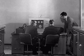 Alan Turing and colleagues work on the Ferranti Mark I Computer in the United Kingdom in 1951.